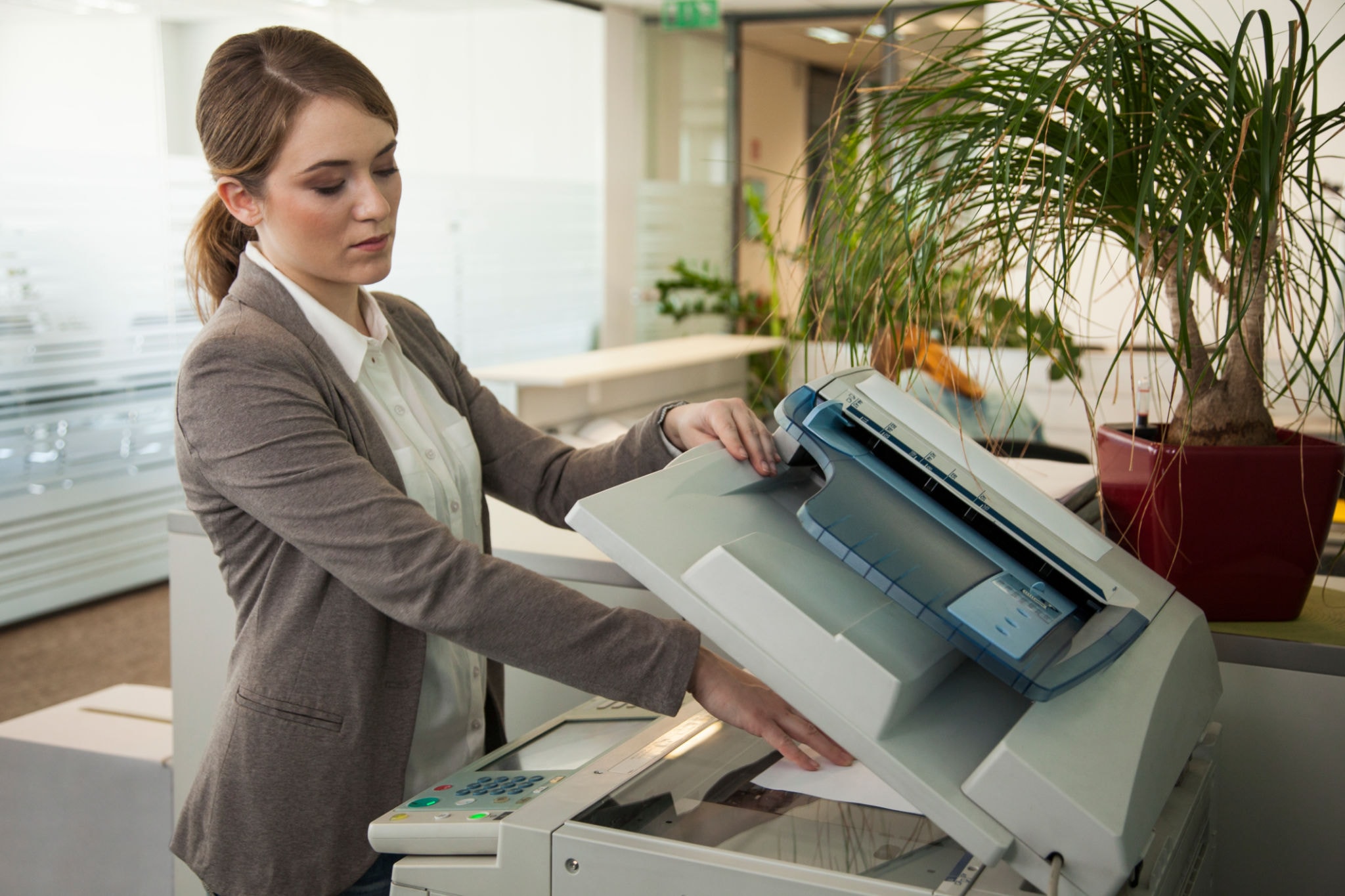 Office professional using a commercial copier machine