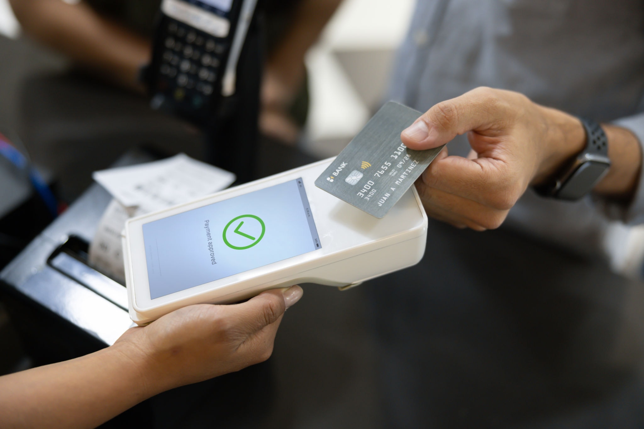 Business owner using a payment terminal